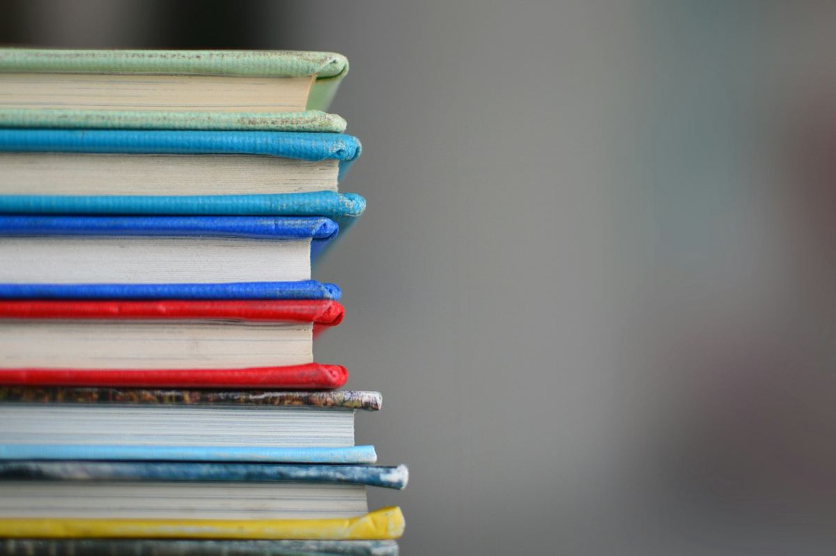 A stack of colourful schoolbooks