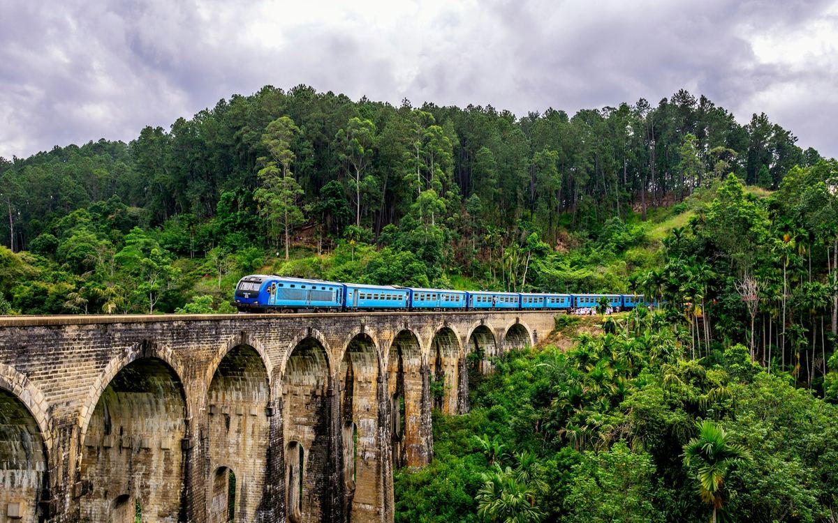 The Nine Arches Bridge in Ella, Sri Lanka, surrounded by lush green hills